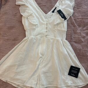 Lulu’s White Ruffled V-Neck Romper